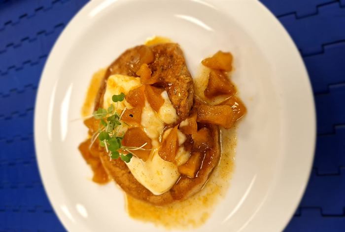 Sliced meat with caramelised apple and a glossy pan sauce