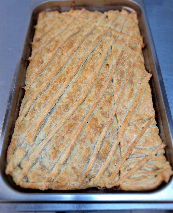 A full tray bake, scored diagonally and glazed